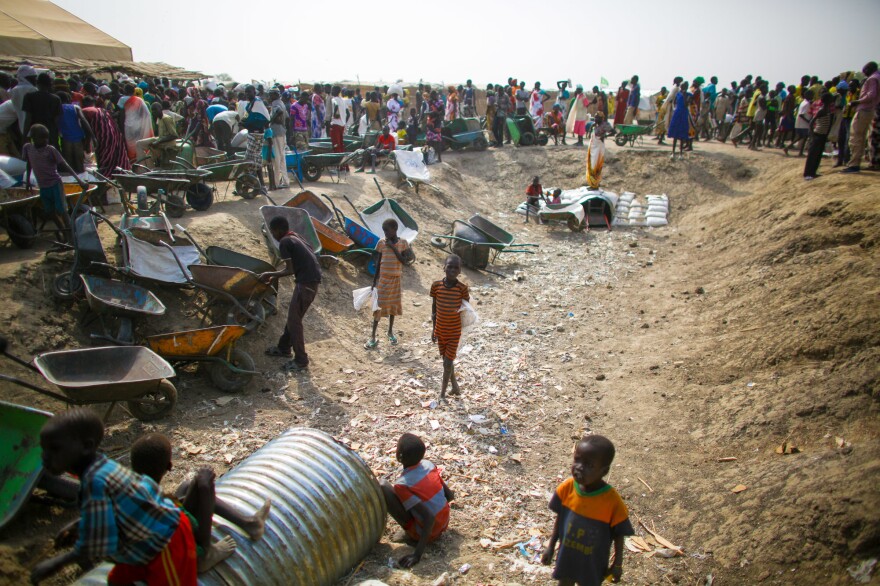 When the monthly food rations are distributed to residents, kids will transport the heavy sacks of sorghum and split peas in exchange for food or money.