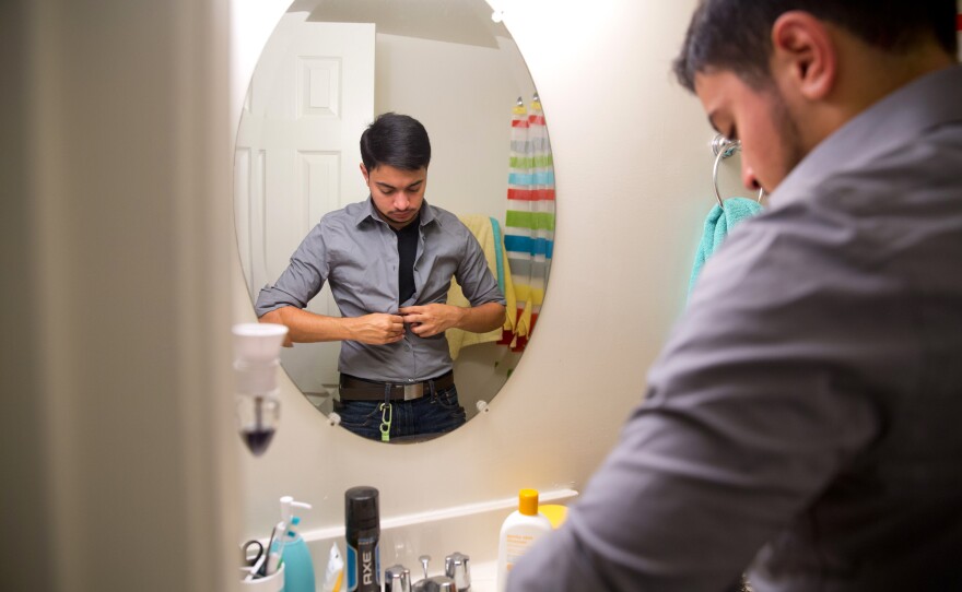 Younes dresses for work in the morning. He says that while telling his story will be his way of putting himself out there, that doesn't make it "open season" for strangers to bluntly ask about personal things like his sexuality. "Everyone's got a different story. There's no cut and dry mold for being transgender," he said.