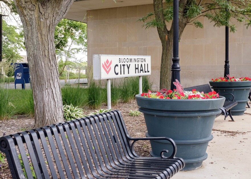 Bench and sign outside Bloomington City Hall