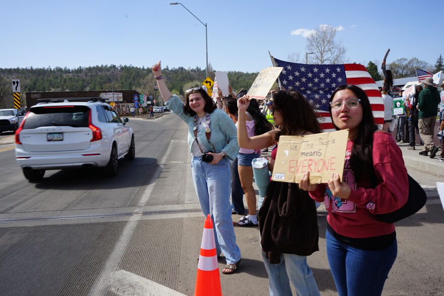 Many protesters said they were anxious and angry about the Trump administration's immigration crackdown and the war with Iran during a protest along Route 66 in Flagstaff, March 28, 2026.