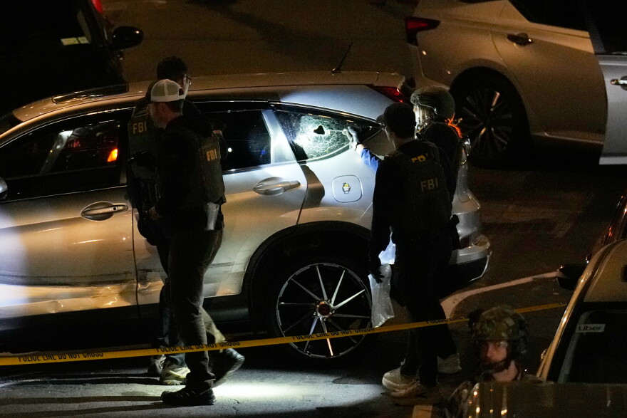 FBI agents perform an investigation at the scene of a shooting on Thursday, Oct. 8, 2026, in New York.