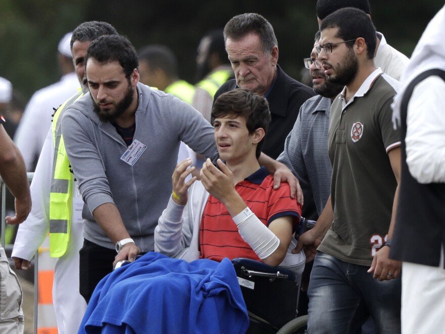 Zaed Mustafa, in a wheelchair after he was injured in the mosque shootings in Christchurch, attends the funeral of his brother, Hamza, and father, Khalid.