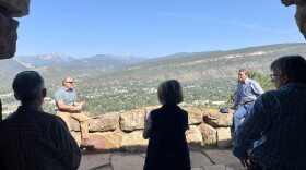 Aaron Kimble from Mountain Studies Institute (left) speaks to Senator Michael Bennet (right) and local officials at Lion's Den at Fort Lewis College.