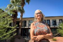 Switchpoint CEO Carol Hollowell stands in a courtyard next to some of the organization’s new affordable apartment homes in St. George, Aug. 25, 2026.