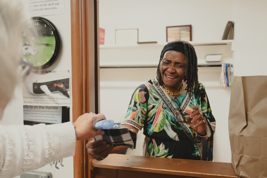 Carol Fette helps Stella Ashcraft at the food pantry at St. Stephen's Episcopal Church in Ferguson on Saturday. The service is offered twice a week, often seeing regulars, especially with increased food insecurity following the end of SNAP benefits.