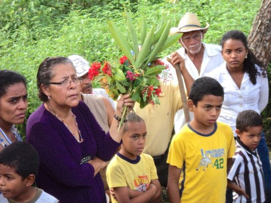 Erlinda, holding flowers