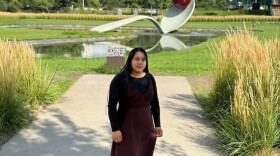 Andrea Pedro Francisco poses in front of "Spoonbridge and Cherry," an artwork at the Minneapolis Sculpture Garden.
