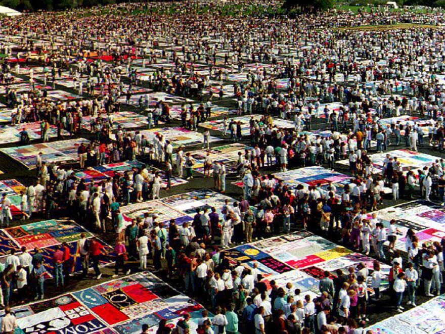 The AIDS Memorial Quilt on display at the Washington Monument in October 1992. The AIDS crisis is the subject of John Corigliano's Symphony No. 1, "Of Rage And Remembrance."