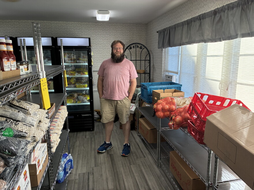 Coordinator Jacob Gordon stands in the Lion’s Share Food Pantry and Clothing Closet at St. Mark’s Lutheran Church in Roanoke.