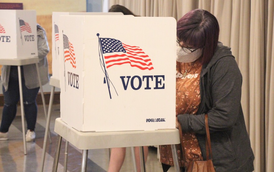 Voters cast their ballots at a polling location in downtown Lawrence.