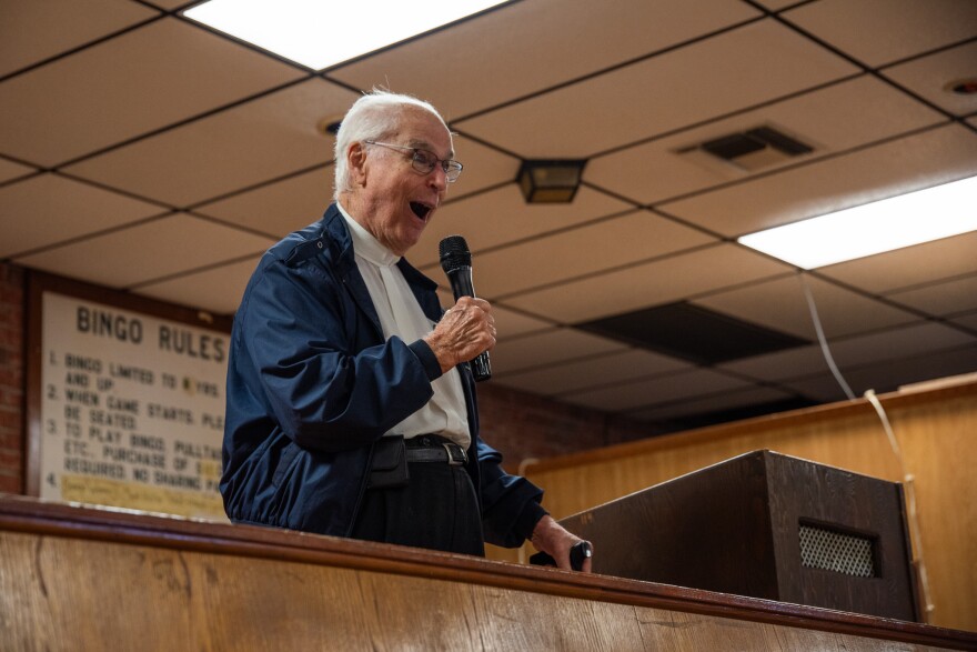 Monsignor Frederic Brunet shares stories from his time as pastor for a Catholic church in Chauvin during a school reunion on Saturday, April 27, 2024. Brunet lived in the area for 42 years.