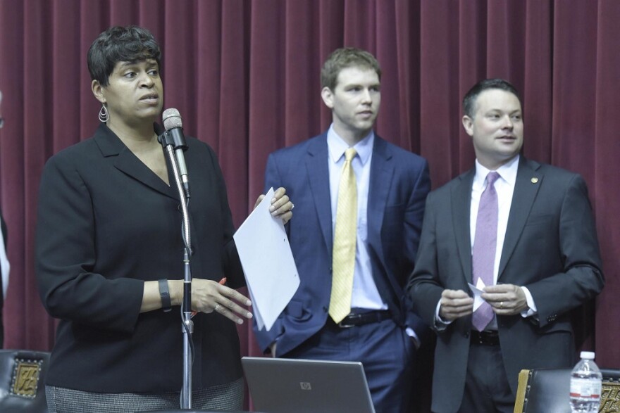 Assistant Minority Floor Leader Gail McCann Beatty, left, directed much of Tuesday's floor debate for Democrats.