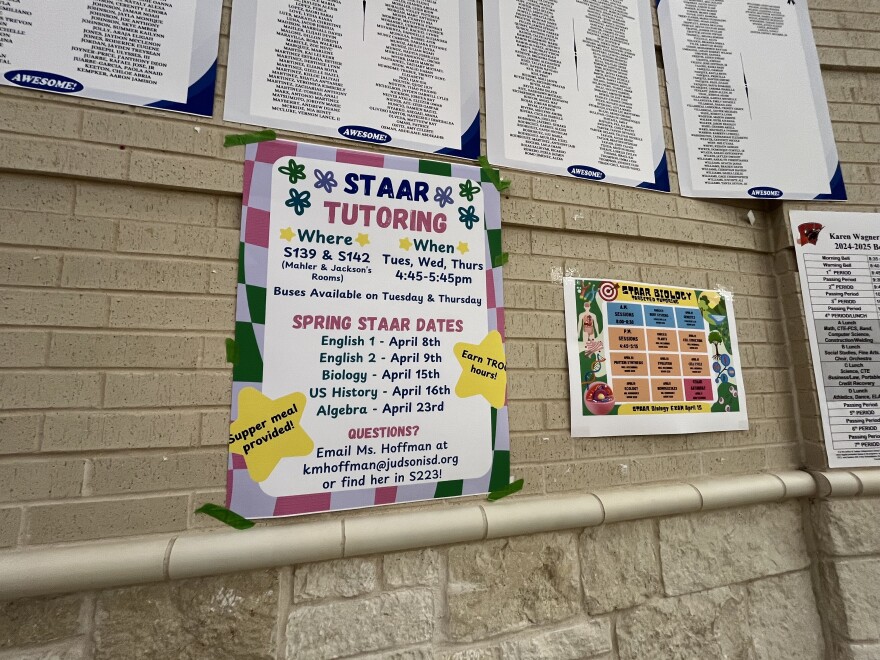 A poster on the wall of Judson ISD's Karen Wagner High School in April 2025 advertises opportunities to receive tutoring ahead of the STAAR End of Course exams. Students are required to pass the exams to graduate unless alternative requirements are met.