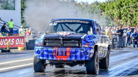 A diesel truck drag racing.