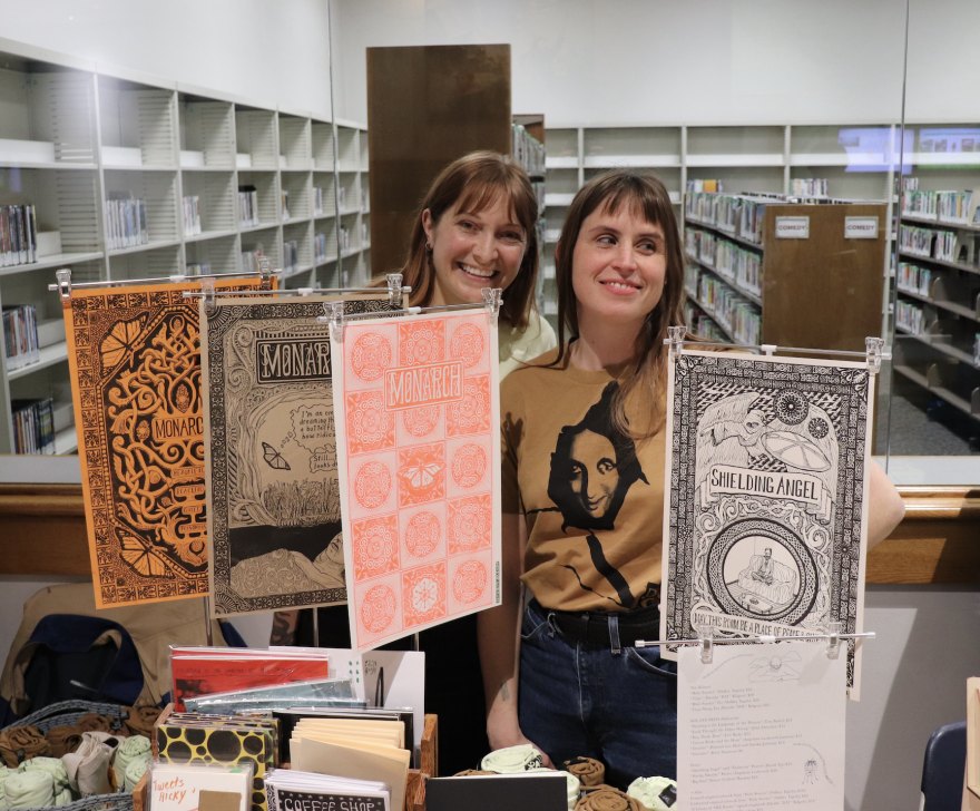 (From left to right) Hannah Hall and Colleen Harriss of Dog Eye Press tabling at Milwaukee Zine Fest.