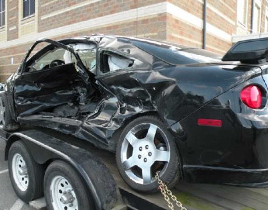 The car that a teenager died in is parked outside Roosevelt High School in Seattle, May 17, 2011.