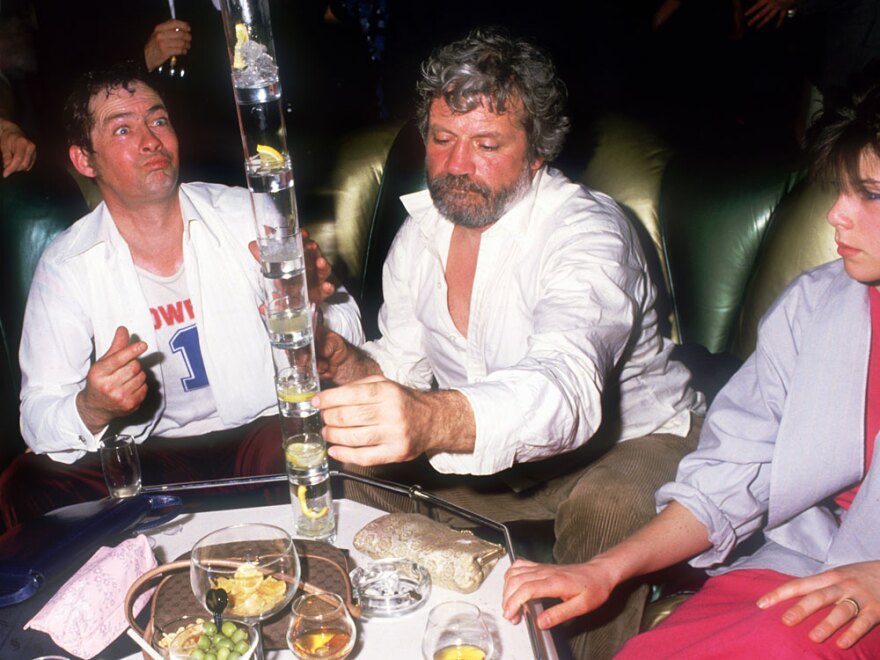 <strong>He Can Top That:</strong> Oliver Reed stacks up the dead soldiers with friends circa 1990.