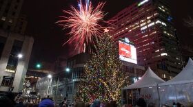 Hundreds gathered at Fountain Square in 2019 to watch the Macy's tree glow. This year, holiday-ready residents will have to watch from their homes. 