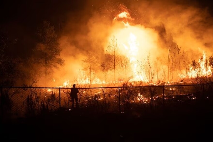 Evidence suggests this fire at Gates School is one of several sparked by power lines on Sept. 7, 2020. A firefighter called 911 to report the fire that started when high winds blew trees into power lines.