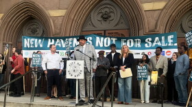 Pastor Scott Marks, Director of New Haven Rising at the microphone as he joined with local organizers and tenants during a press conference October 20, 2026 outside the New Haven City Hall to ban short-term rentals in an effort to protect New Haven's housing market.