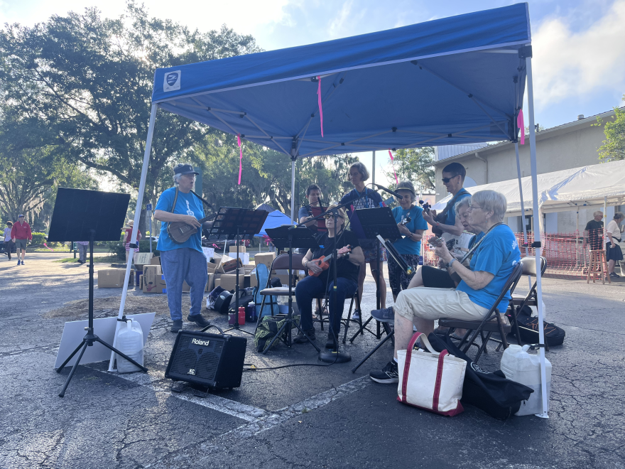 The Gainesville Ukulele Club welcome visitors on the first day of the Friends of the Library spring book sale. Nathan Thomas/WUFT News)