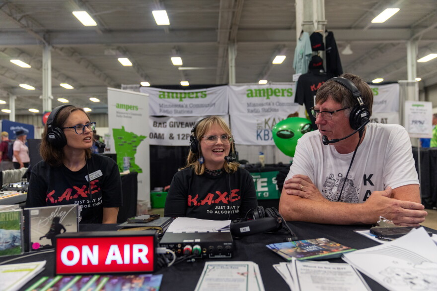  Jennifer Barr, Heidi Holtan, and KAXE volunteer Mark Klabunde during an interview broadcast live on August 28, 2026 from the Minnesota State Fair.