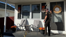 A Vanderburgh County sheriff's deputy knocks on a door to check the status of an offender in advance of Halloween