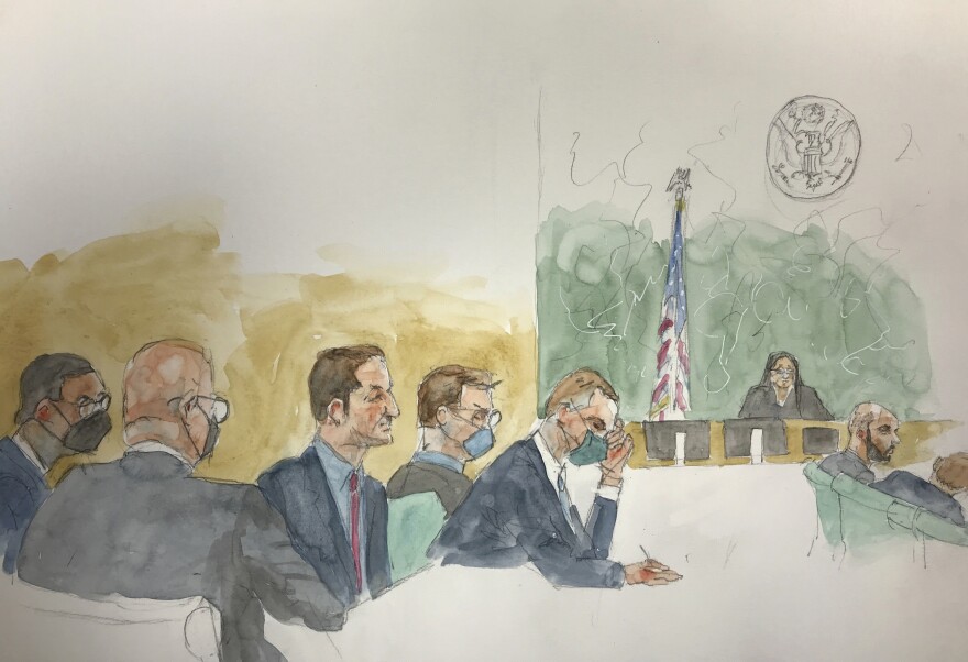 In this courtroom sketch, defendants Hernan Lopez, center, and Carlos Martinez, second from right, sit with their attorneys as the jury deliberates, Tuesday, March 7, 2023, at Brooklyn federal court in New York. (Aggie Whelan Kenny via AP)