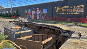 Work continues to repair two sinkholes on Horton Street, Wilkes-Barre, including this one which opened up between Church and Warren streets on July 14. Mayor George Brown and other officials held a community meeting Monday evening, July 28 to update residents on the status of the work, which Brown said is expected to continue for 'at least' another month.