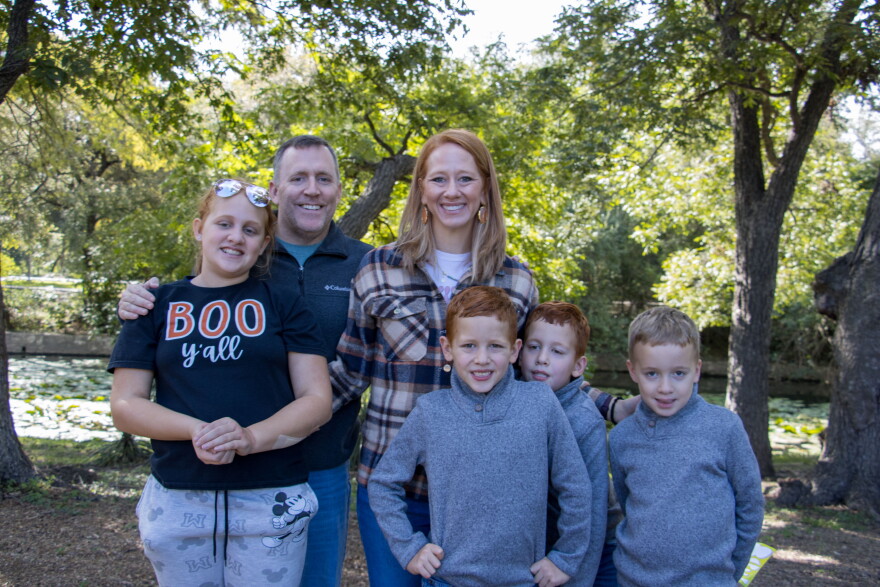 The Riddell family poses for a photo together during the 2026 NICU Family Reunion at Brackenridge Park. Triplets Kyle, Nathan and Mal stayed in the NICU for just under a month after birth.
