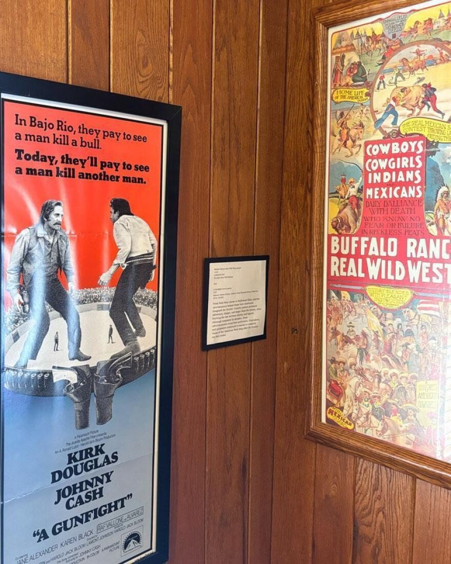 Two of the posters included in the "Ragged Old Flag" exhibit at the Johnny Cash Boyhood Home.