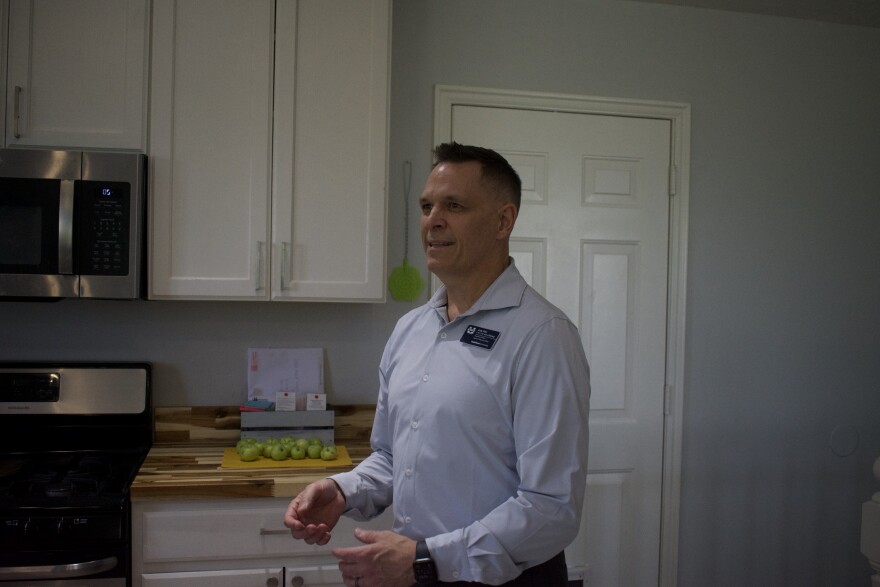 Andy Allen, director of Utah State University’s Veterans Resource Office, stands inside a home in Hyde Park, Utah, on July 15, 2025. Allen is helping lead an effort to turn the house into housing for student veterans facing homelessness or isolation.