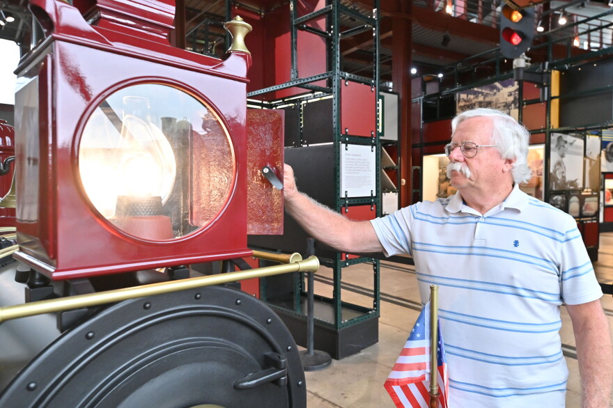 Dan Hryhorcoff closes the lantern of the train, which he made of fiberglass.