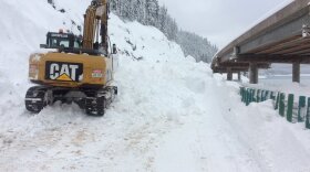 That road was covered by 15 feet of snow in the Snoqualmie Pass area. (The road is still six feet under the excavator.) More than 112 inches of snow have fallen in the last seven days.