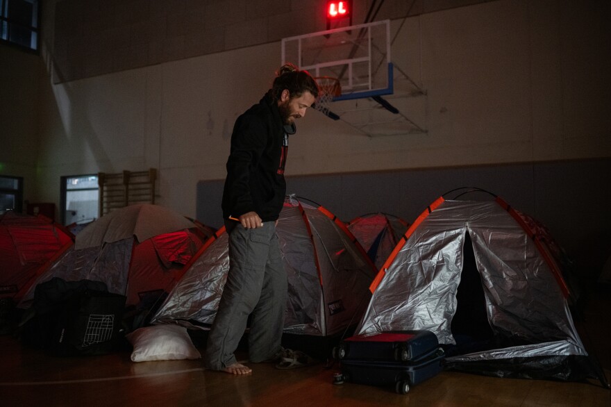 Itay Siegel, whose aunt Aviva was freed and uncle Keith remains hostage, prepares to sleep in a gym at Kibbutz Tsor'a with other families on March 1. "I want to make sure that in this story, there is a chapter about - kedushat ha-hayyim – about the importance of life – that life is much more important than death, it's much more important than ego, it's much more important than land," Siegel said.