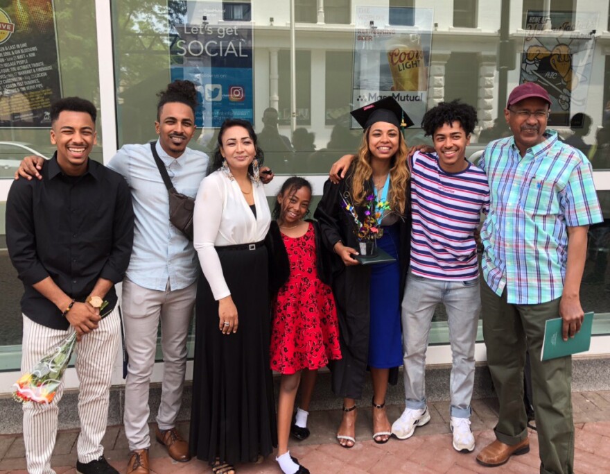 Ithar Gabriel completed a degree at Holyoke Community College recently. Here she is in cap and gown on graduation day, with family members.