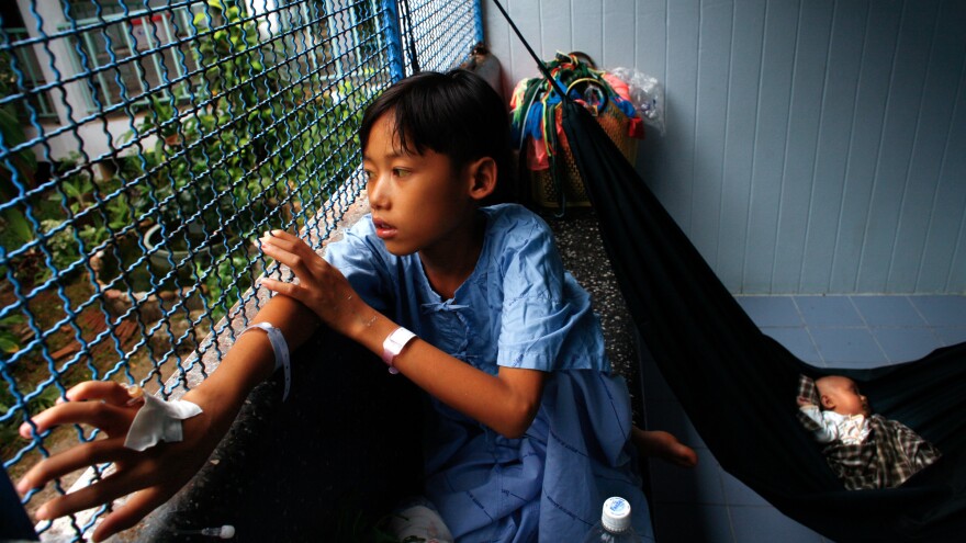 Kanu, 13, is treated for hepatitis at a hospital in Thailand.