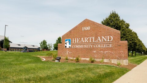 Brick sign in the lawn with the inscription Heartland Community College