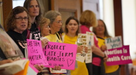 Protesters line the hallway leading to the House Chamber, Wednesday, June 21, 2023, at the State House in Augusta, Maine. The Legislature is working to wrap up the current session before summer break.