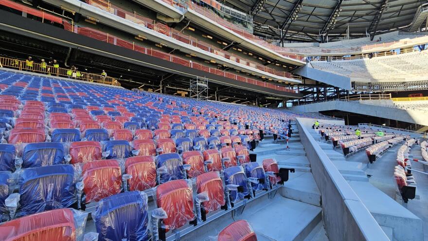 Crews work on new seat installations at the future Highmark Stadium for the Buffalo Bills.