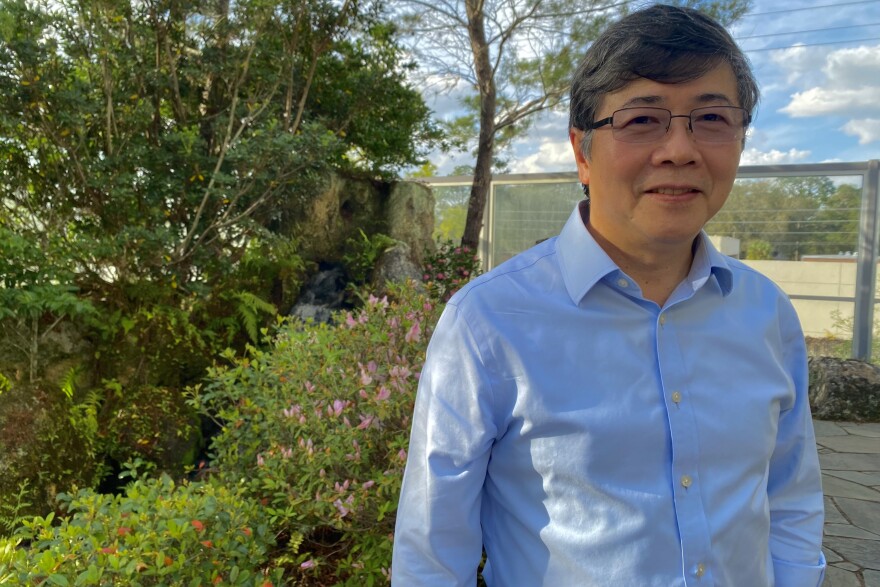 Kuiyi Shen, 68, stands in one of the Harn Museum of Art’s Asian gardens. Shen arrived early to ensure the night would run smoothly. (Luis-Alfredo Garcia/WUFT News)