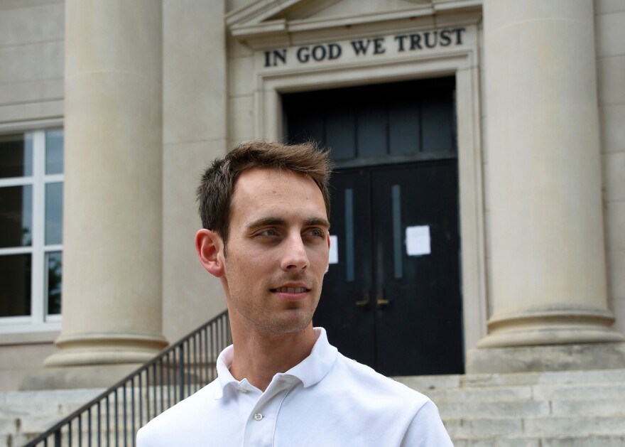 FILE - Matthew Fenner stands outside Rutherford County Courthouse after a hearing on his case against Word of Faith Fellowship church in Rutherfordton, N.C., May 19, 2017. (AP Photo/Kathy Kmonicek, File)