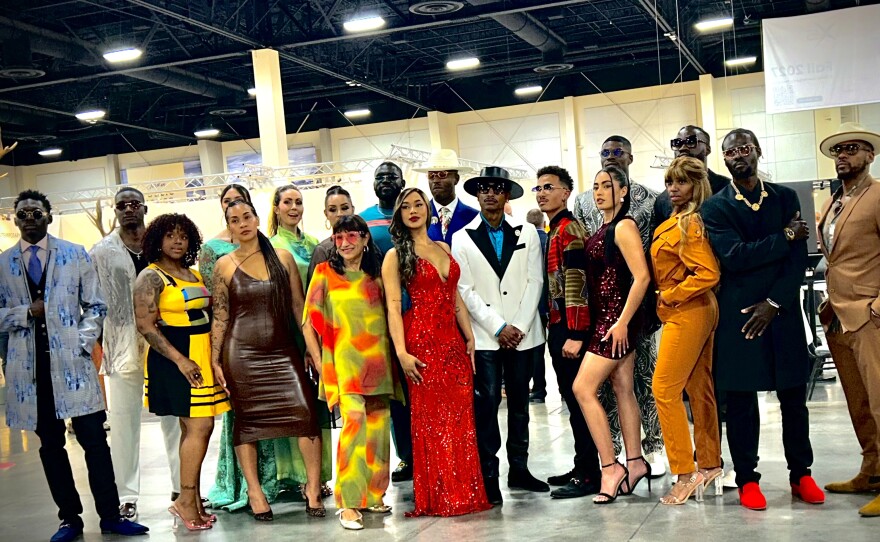 A group of people stand together in a posed photo