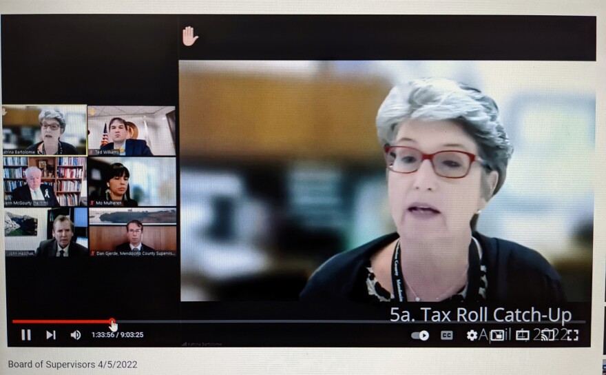 A YouTube meeting screen. On the right, in large view, a woman gives a presentation to five people in smaller view.