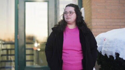 Jena Gross stands for a photo outside her apartment building in Parma.