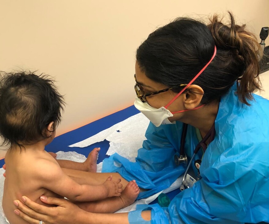 Dr. Mona Amin with her son at Pediatric Associates in Florida in September 2020.