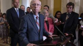 Senate Minority Leader Mitch McConnell returns to his press conference after he froze at the microphones and became disoriented. (Scott Applewhite/AP)