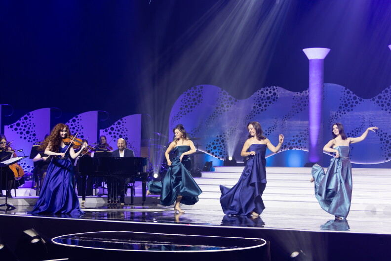 Celtic Woman perform on stage.