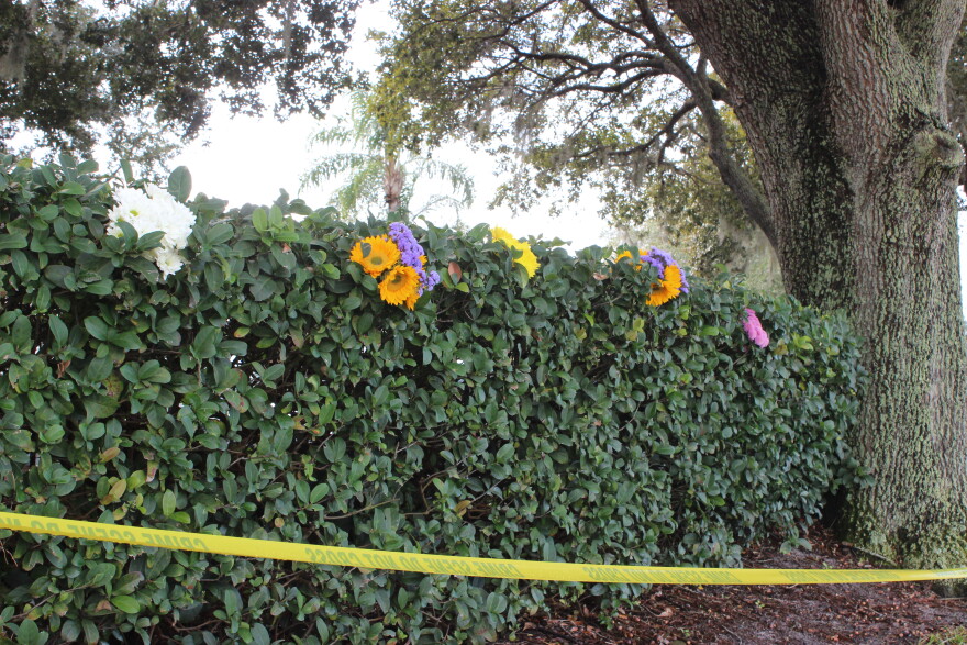 Caution tape kept people away from the bank, which was still an active crime scene. But it didn't stop residents from paying their respects.