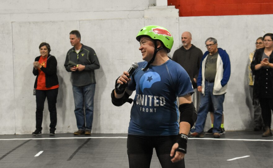 Pioneer Valley Roller Derby board co-chair Alex Kapitan (aka Peter Pandemonium) speaks to the crowd on Sept. 14, 2019, at The Bunker.